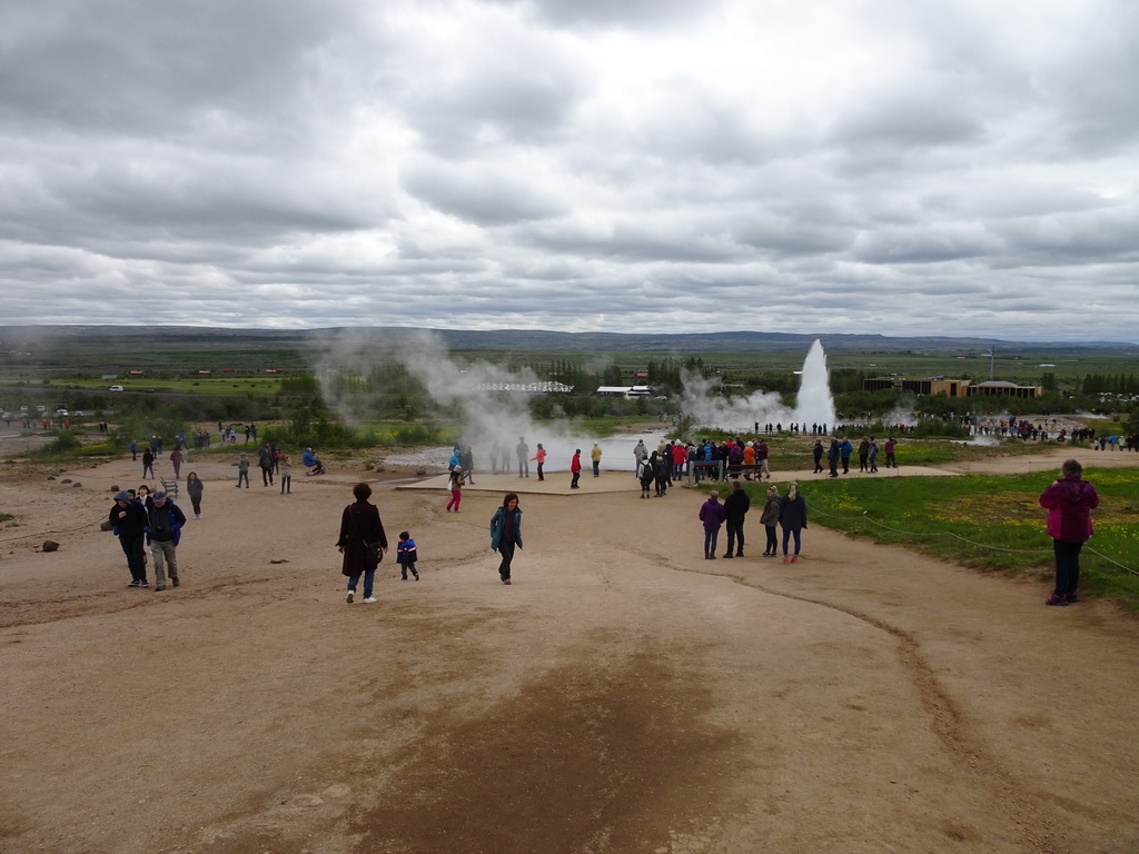 Miaomiao and Max at the Geysir geothermal area with the Blesi and Fata geysers and the erupting Strokkur geyser