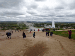 Miaomiao and Max at the Geysir geothermal area with the Blesi and Fata geysers and the erupting Strokkur geyser
