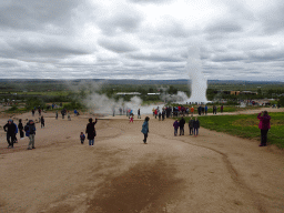 Miaomiao and Max at the Geysir geothermal area with the Blesi and Fata geysers and the erupting Strokkur geyser