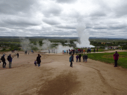 Miaomiao and Max at the Geysir geothermal area with the Blesi and Fata geysers and the erupting Strokkur geyser