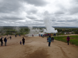 Miaomiao and Max at the Geysir geothermal area with the Blesi and Fata geysers and the erupting Strokkur geyser