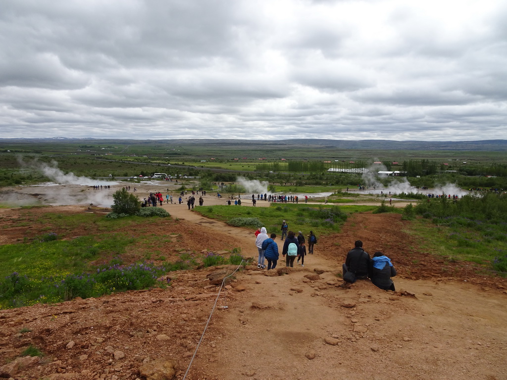 The Geysir geothermal area with the Konungshver, Geysir and Strokkur geysers and other geysers, viewed from the path to the Útsýnisskífa viewpoint