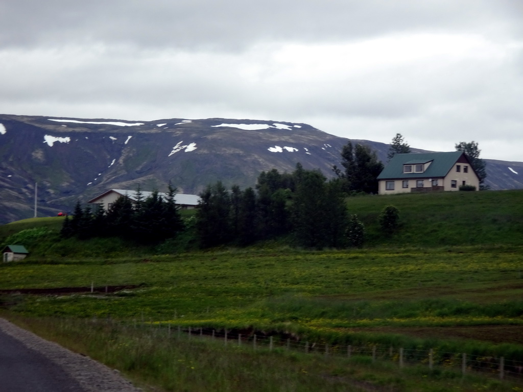 Houses and mountains, viewed from the rental car on the Laugarvatnsvegur road to Selfoss