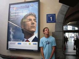 Tim with a commercial poster at the Gent-Sint-Pieters railway station