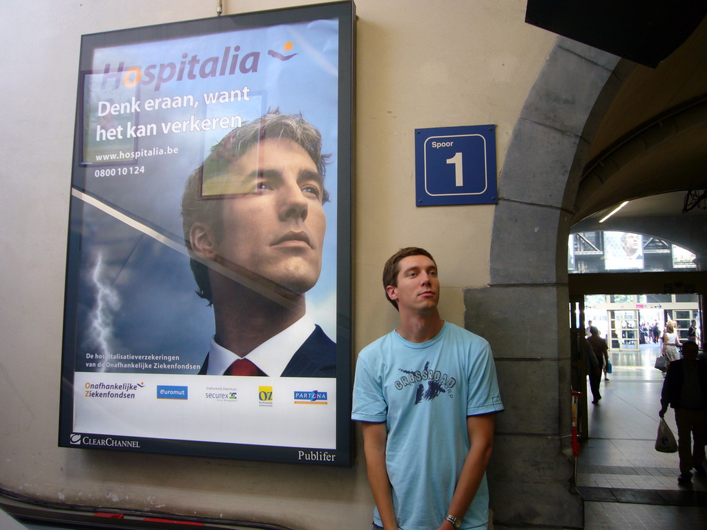 Tim with a commercial poster at the Gent-Sint-Pieters railway station