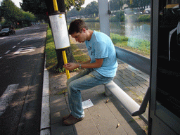 Tim at a bus stop at the Neermeerskaai street