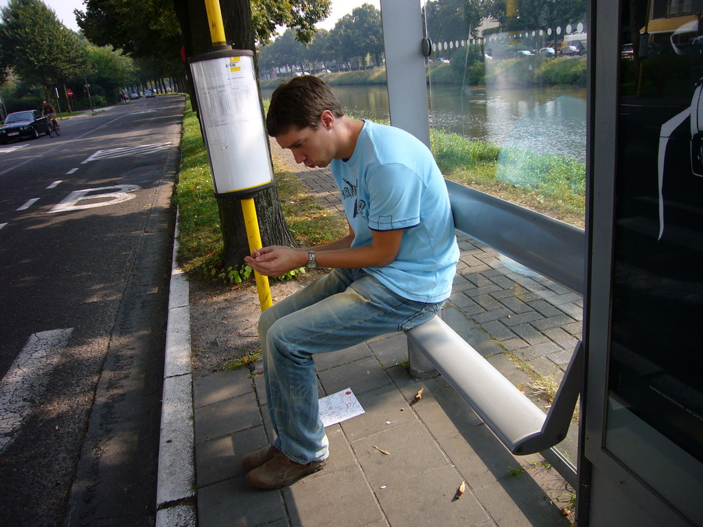 Tim at a bus stop at the Neermeerskaai street