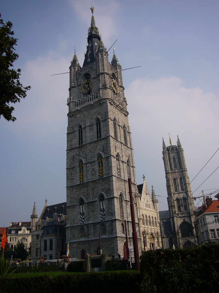 The Emile Braunplein square, the Belfry of Ghent, the Lakenhalle building and the tower of the Sint-Baafs Cathedral