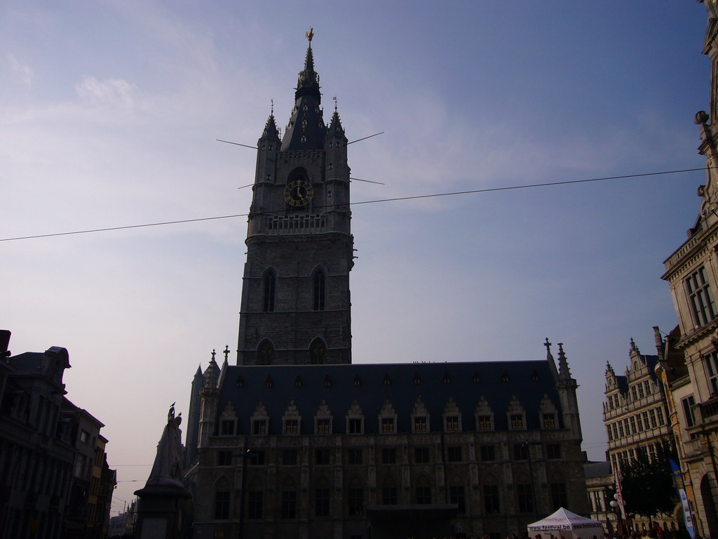 The east side of the Belfry of Ghent and the Lakenhalle building, and the statue of Jan-Frans Willems at the Sint-Baafsplein square