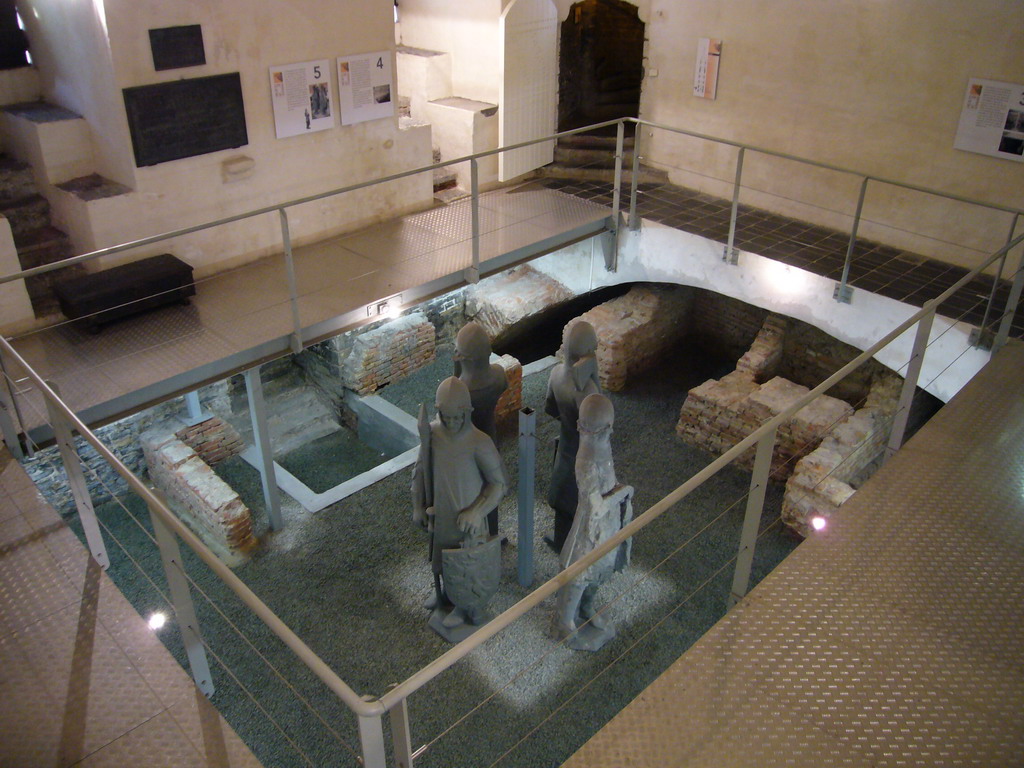 Statues and excavated walls at the Secrecy Room in the basement of the Belfry of Ghent