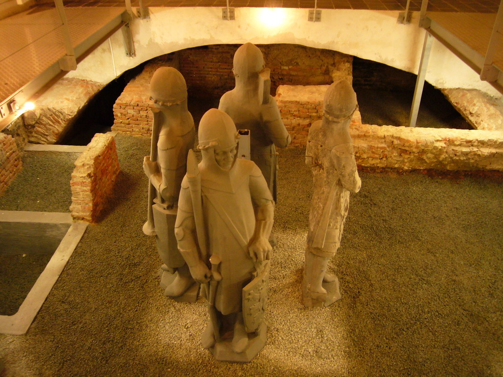 Statues and excavated walls at the Secrecy Room in the basement of the Belfry of Ghent