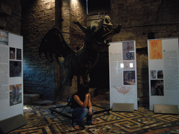 Miaomiao in front of a dragon statue at the Tower Keepers Room at the first floor of the Belfry of Ghent