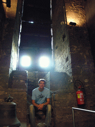 Tim with a bell at the Bell Museum at the second floor of the Belfry of Ghent