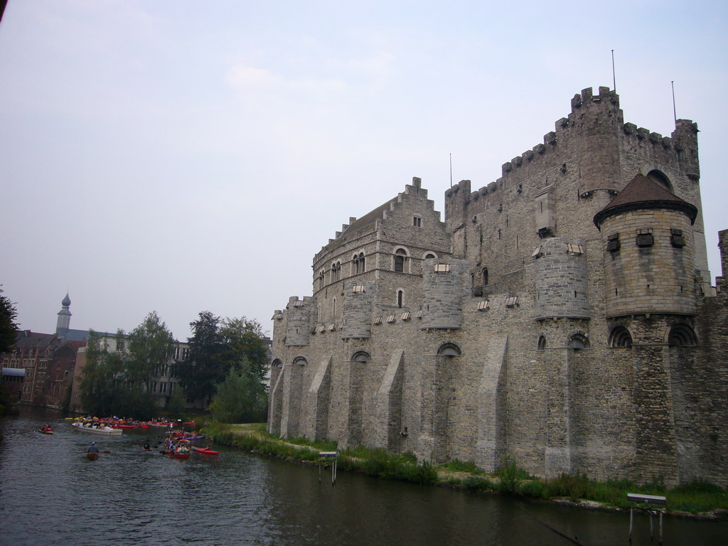 The Gravensteen Castle and baots on the Leie river, viewed from the Execution Bridge