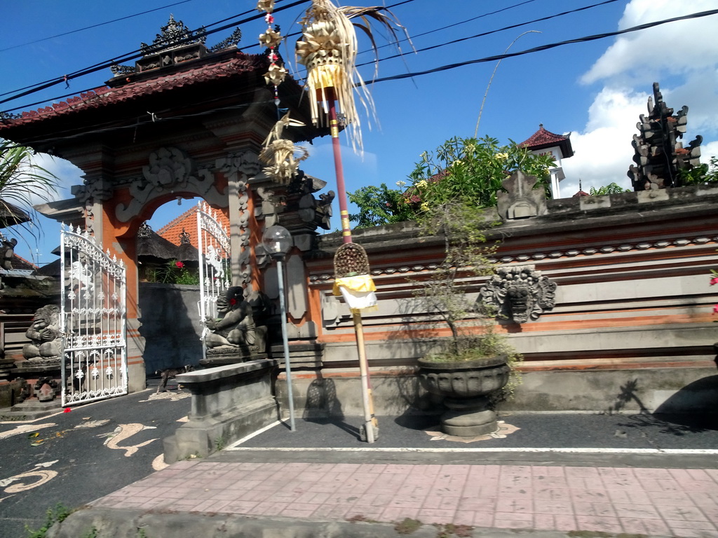 Gate of a temple at the Jalan Raya Ketewel street at Ketewel, viewed from the taxi