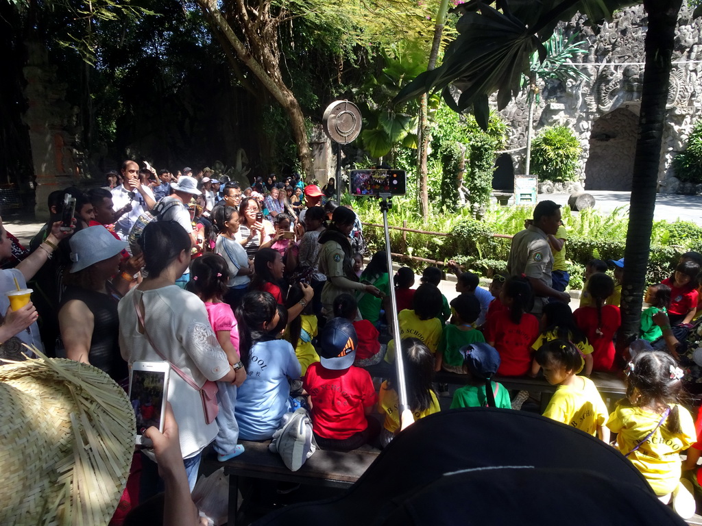 Zookeeper with a snake walking through the audience at the Hanuman Stage at the Bali Safari & Marine Park, during the Animal Show