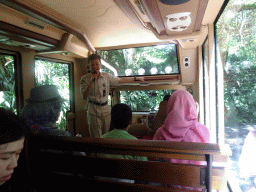 Zookeeper and tourists in the safari bus at the Terminal Toraja at the Bali Safari & Marine Park