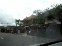 Shop with stone sculptures, viewed from the taxi to Ubud