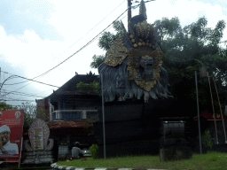 Statue at the Jalan A. A. Gede Rai street, viewed from the taxi to Ubud