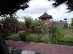 Temple at the Jalan Raya Sukawati street, viewed from the taxi from Ubud