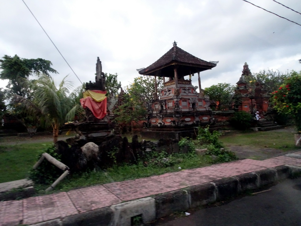 Temple at the Jalan Raya Sukawati street, viewed from the taxi from Ubud