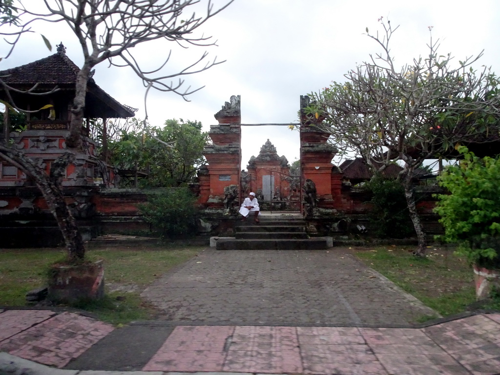 Temple at the Jalan Raya Sukawati street, viewed from the taxi from Ubud