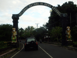 Welcome gate to the viillage of Ketewel at the Jalan Raya Guwang street, viewed from the taxi from Ubud