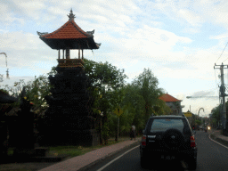 Tower of the Pura Pasek Gelgel Ketewel temple at the Jalan Raya Ketewel street at Ketewel, viewed from the taxi from Ubud