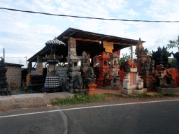 Shop with stone sculptures at the Jalan Raya Ketewel street at Ketewel, viewed from the taxi from Ubud