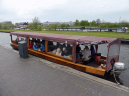 Miaomiao`s parents in our tour boat at the canal along the Dominee T.O. Hylkemaweg street