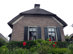 House and flowers at the Binnenpad canal, viewed from our tour boat