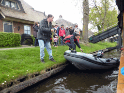 Tourists trying to get a boat unstuck on the Binnenpad canal, viewed from our tour boat