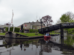 Boat, bridges and houses at the Binnenpad canal, viewed from our tour boat