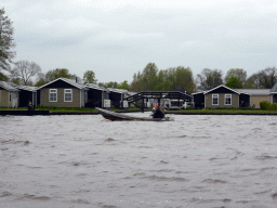 Boat on the Bovenwijde lake and the Vakantiepark Giethoorn holiday resort, viewed from our tour boat