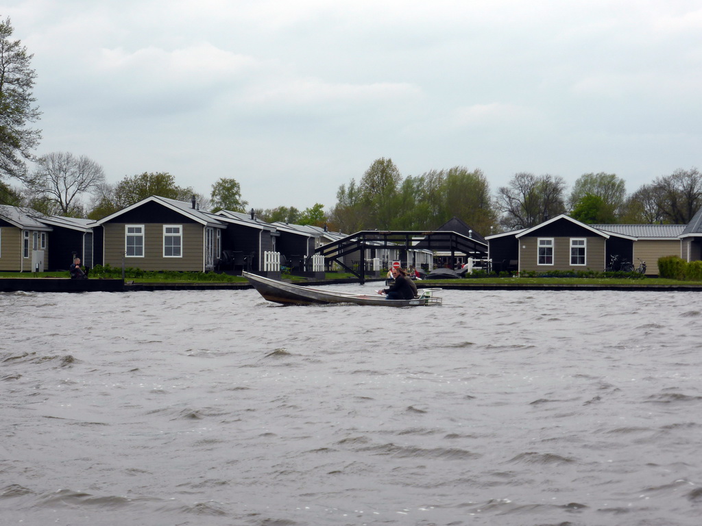 Boat on the Bovenwijde lake and the Vakantiepark Giethoorn holiday resort, viewed from our tour boat