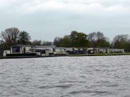 Holiday houses at the banks of the Bovenwijde lake, viewed from our tour boat