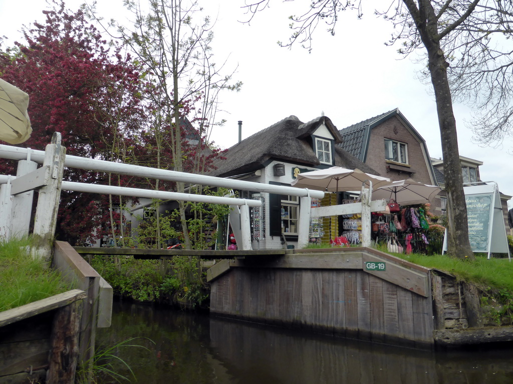 Houses and a bridge over a canal, viewed from our tour boat on the Binnenpad canal
