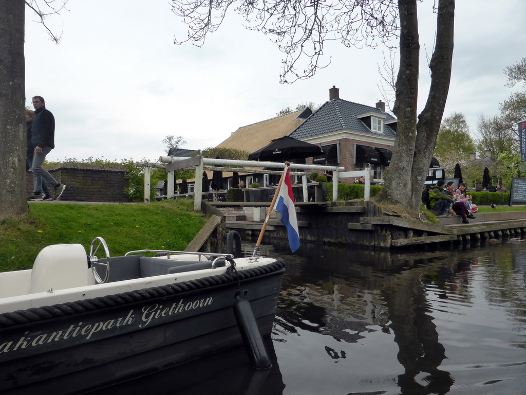 The Brasserie De Grachthof restaurant, a boat and a bridge over a canal, viewed from our tour boat on the Binnenpad canal