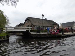 The `t Achterhuus restaurant and a bridge over a canal, viewed from our tour boat on the canal along the Dominee T.O. Hylkemaweg street