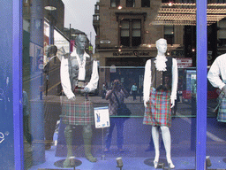 Mannequins with kilts in a shopping window in the city center