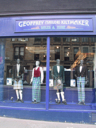 Mannequins with kilts in a shopping window in the city center