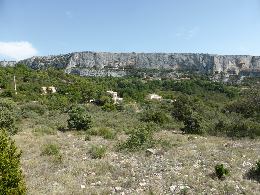 Cliff at the east side of the town of Lioux, viewed from the D60A road from Sault