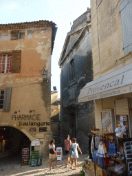 The Rue de l`Église street with the front of the Église Saint Firmin church