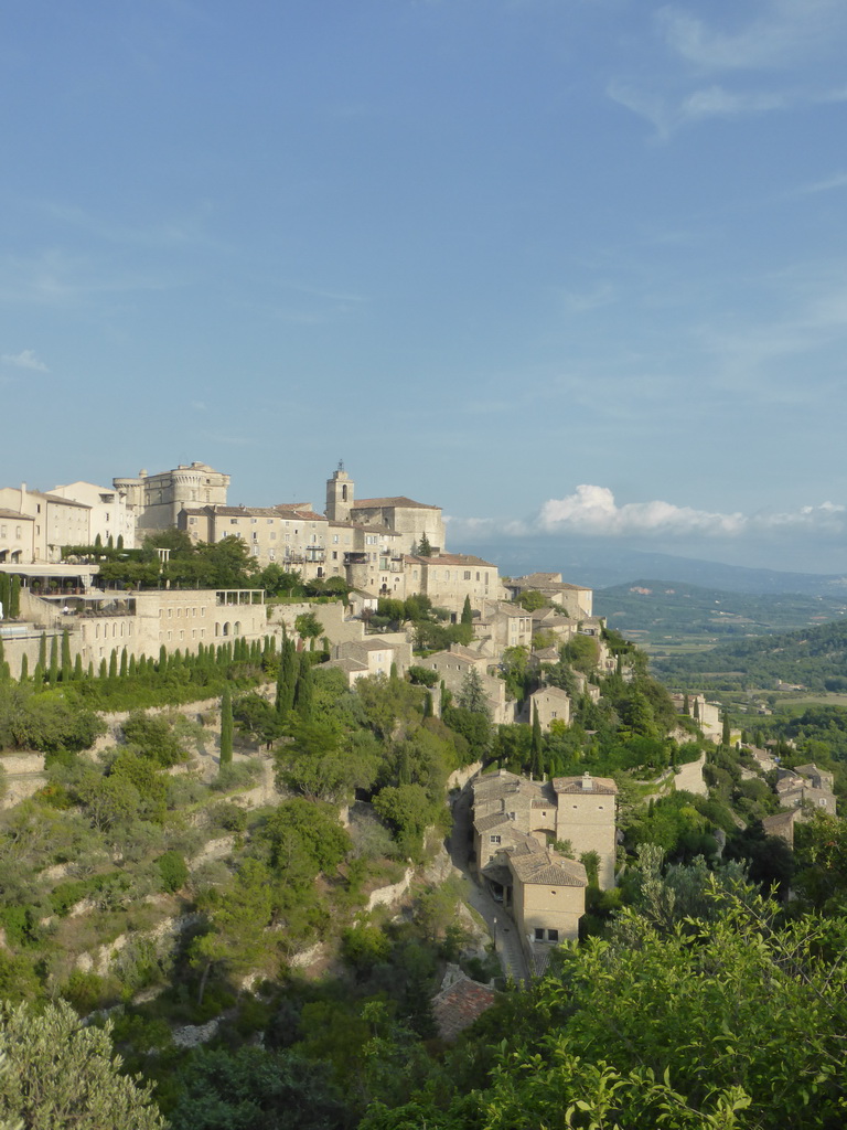 The southwest side of town with the Château de Gordes castle and the Église Saint Firmin church, viewed from the crossing of the Route de Cavaillon road and the Route de Senanque road