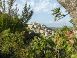 The southwest side of town with the Château de Gordes castle and the Église Saint Firmin church, viewed from a parking place next to the Route de Cavaillon