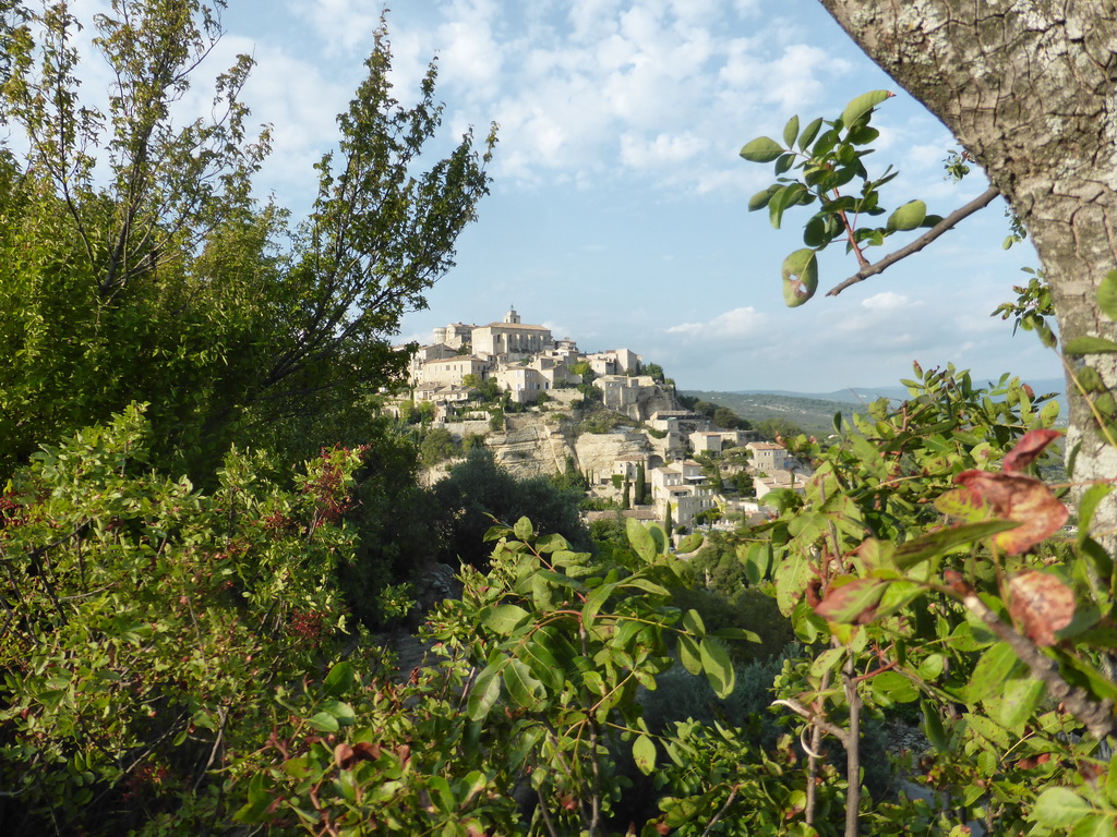 The southwest side of town with the Château de Gordes castle and the Église Saint Firmin church, viewed from a parking place next to the Route de Cavaillon