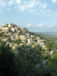 The southwest side of town with the Château de Gordes castle and the Église Saint Firmin church, viewed from a parking place next to the Route de Cavaillon