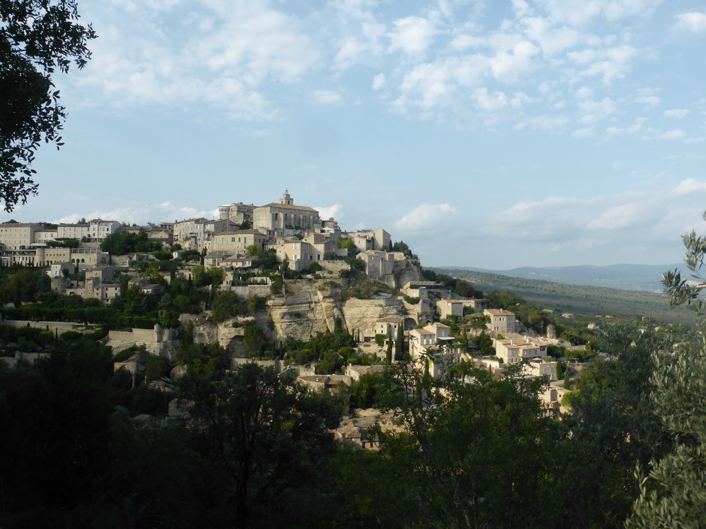 The southwest side of town with the Château de Gordes castle and the Église Saint Firmin church, viewed from a parking place next to the Route de Cavaillon
