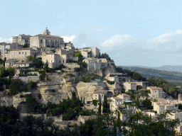 The southwest side of town with the Château de Gordes castle and the Église Saint Firmin church, viewed from a parking place next to the Route de Cavaillon