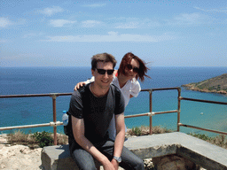 Tim and Miaomiao at the Calypso Cave viewing point, with a view on Ramla Bay